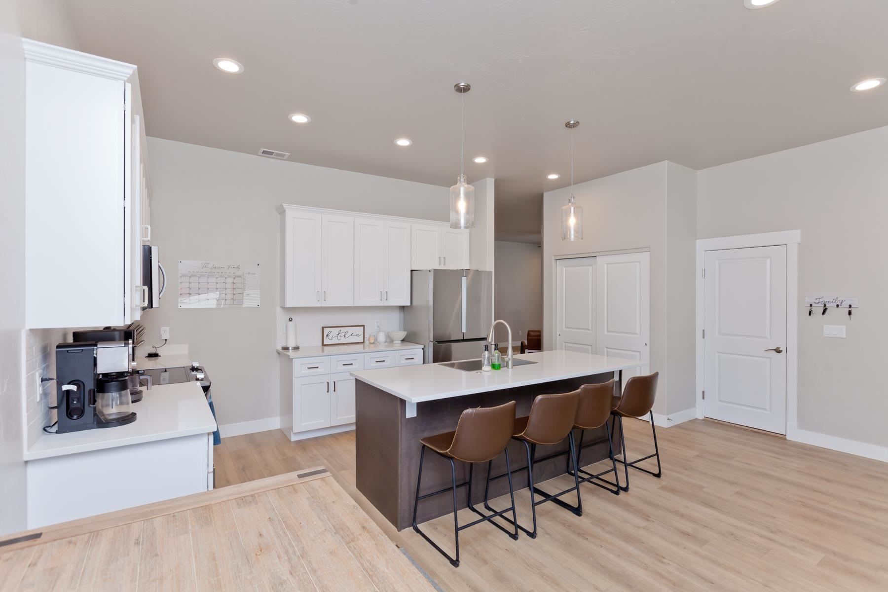 628 Thunder Ridge Drive Grand Junction, CO 81504 - Photo 7 of 37 a kitchen with stainless steel appliances kitchen island hardwood floor sink and stove