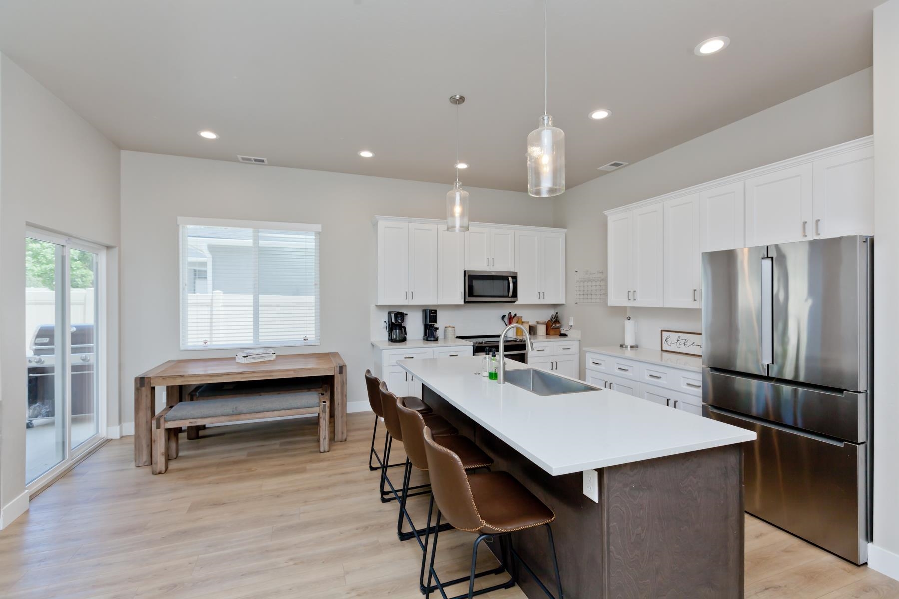 628 Thunder Ridge Drive Grand Junction, CO 81504 - Photo 10 of 37 a kitchen with kitchen island a dining table and chairs