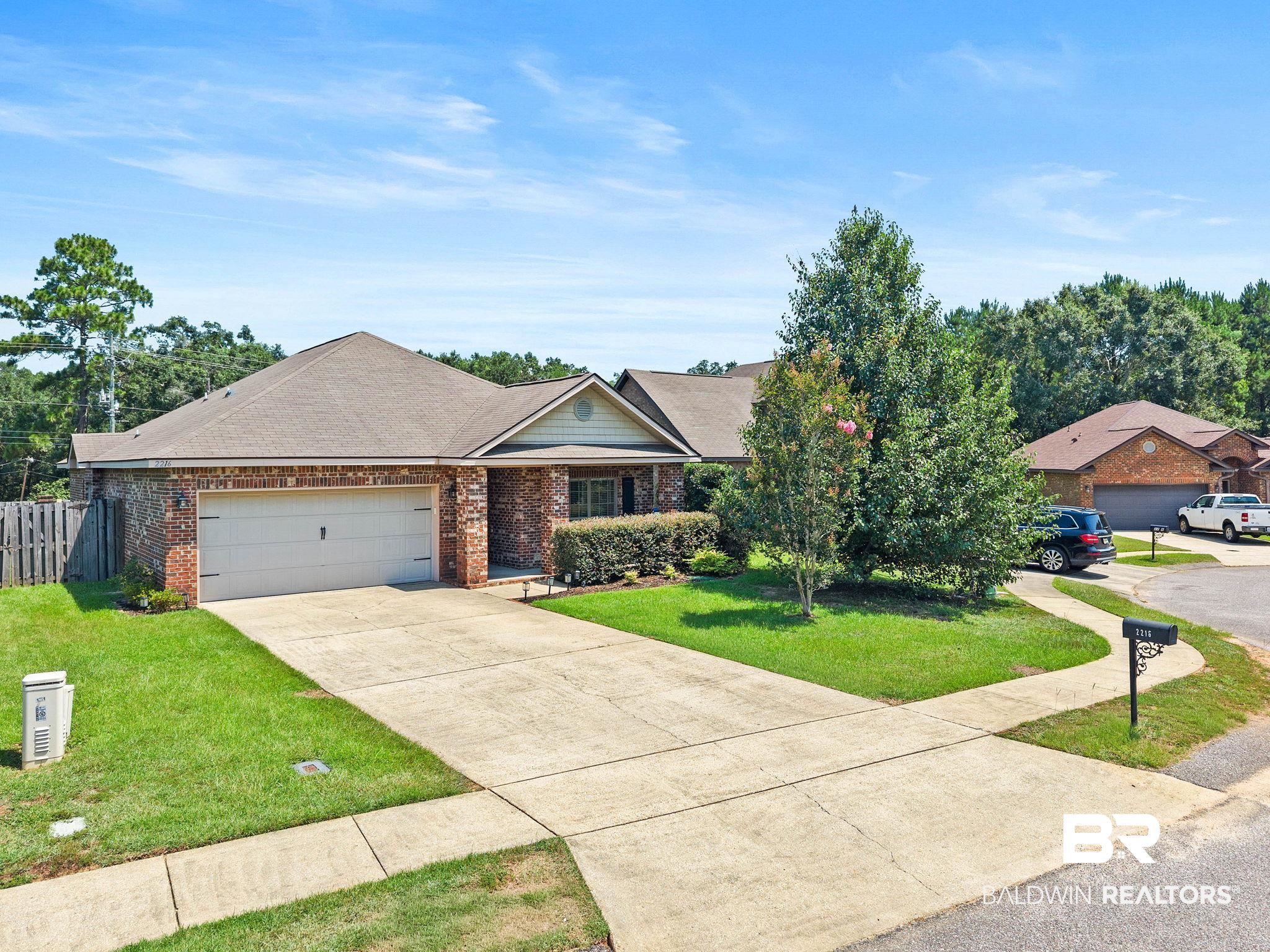 2216 Livingstone Court Mobile, AL 36695 - Photo 1 of 62 Brick exterior with a gabled roofline and attached garage