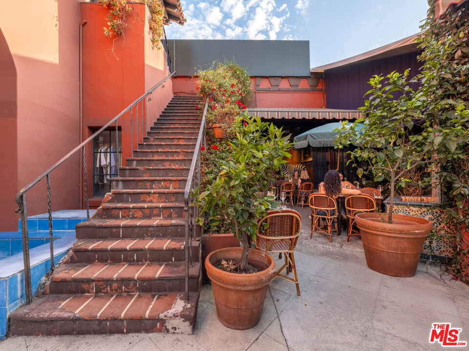 3924 Sunset Boulevard Los Angeles, CA 90029 - Photo 17 of 70 a view of a patio with couches and potted plants