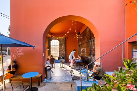 a view of a chairs and tables in a patio