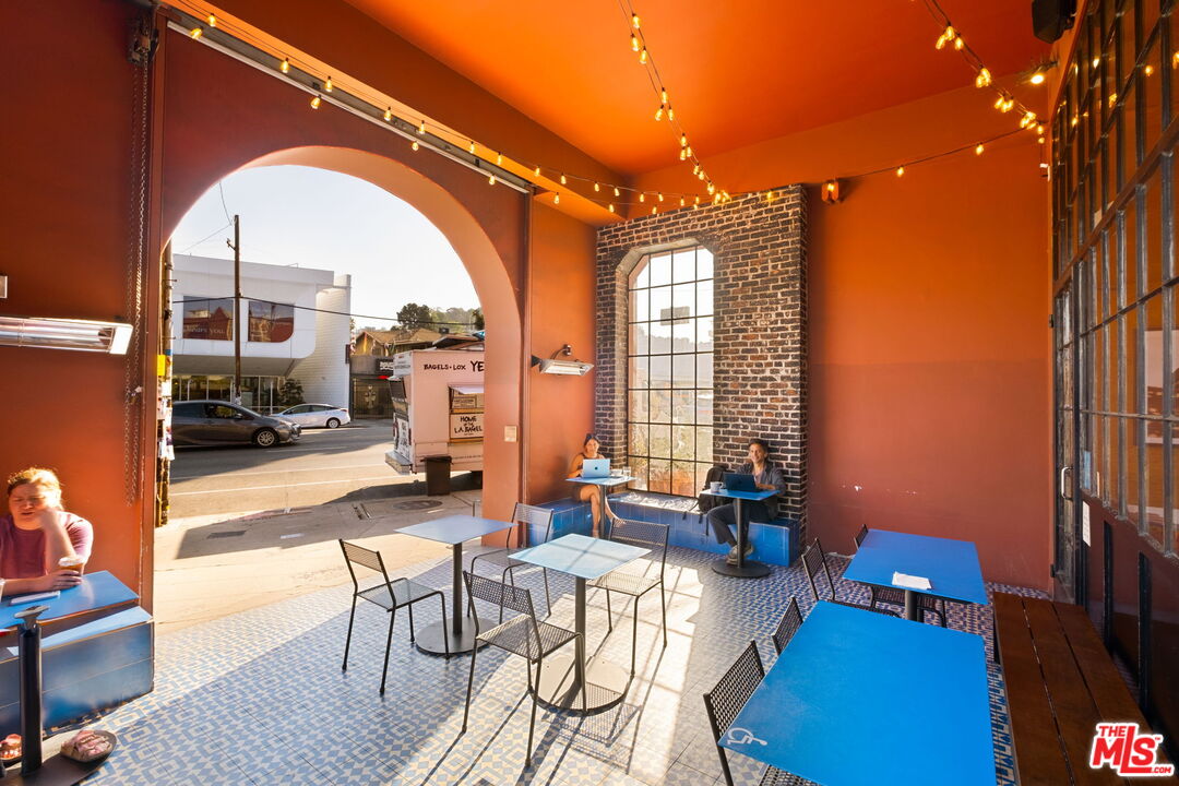 3924 Sunset Boulevard Los Angeles, CA 90029 - Photo 25 of 70 a living room with furniture and a floor to ceiling window
