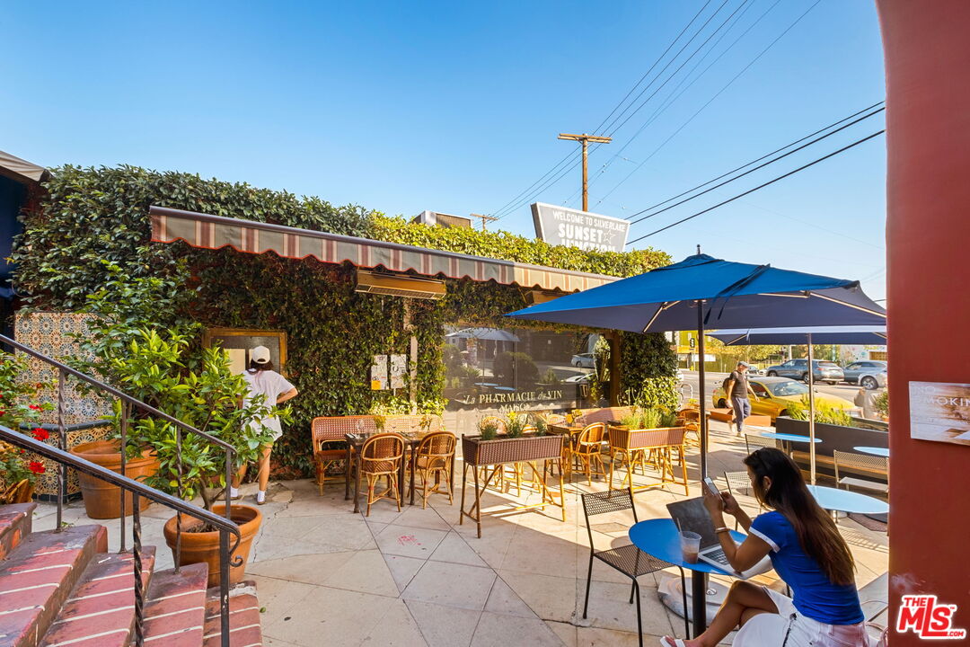 3924 Sunset Boulevard Los Angeles, CA 90029 - Photo 29 of 70 a view of a patio with table and chairs under an umbrella