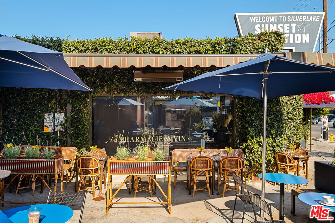 3924 Sunset Boulevard Los Angeles, CA 90029 - Photo 30 of 70 a view of a patio with table and chairs under an umbrella