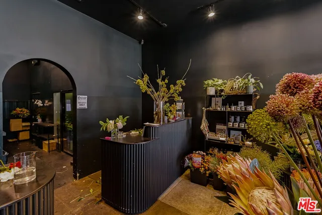 a room with lots of furniture and chandelier