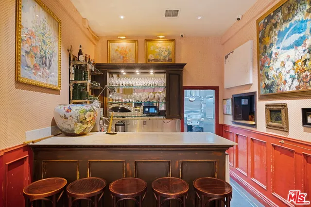 a kitchen with stainless steel appliances kitchen island granite countertop a sink and cabinets