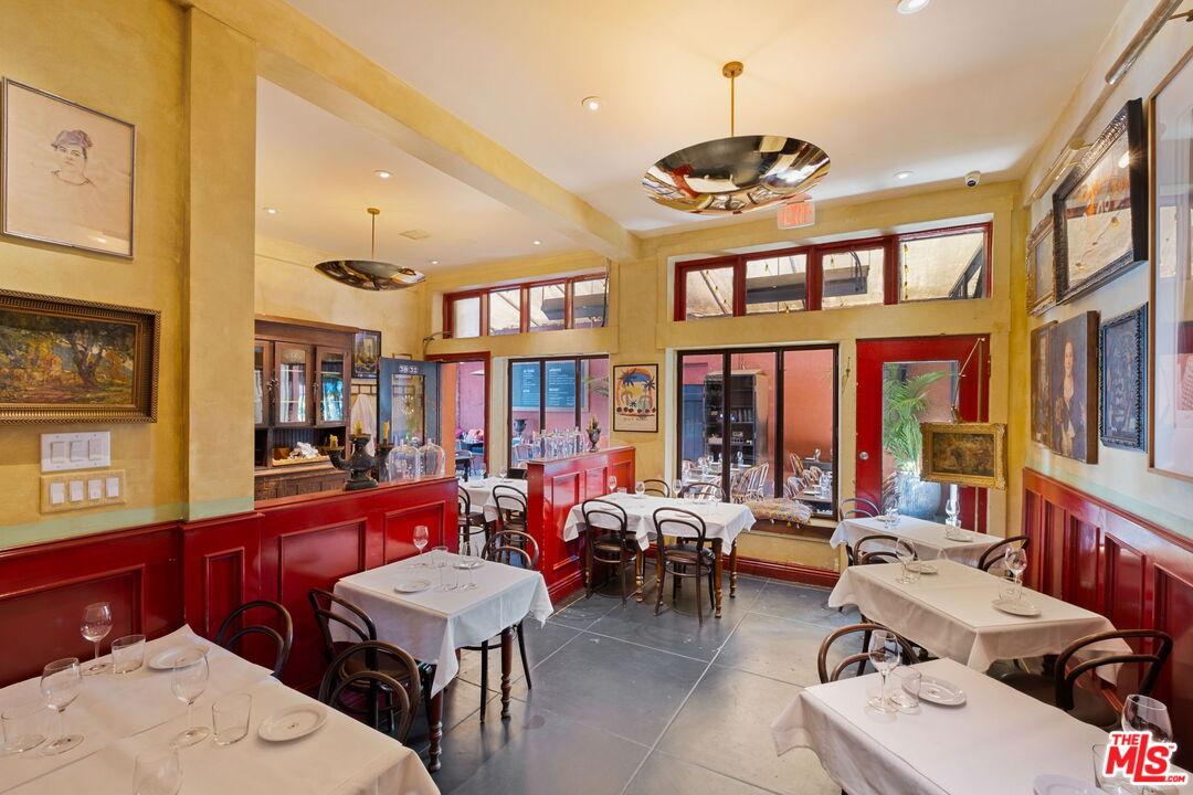 3924 Sunset Boulevard Los Angeles, CA 90029 - Photo 43 of 70 a room with lots of furniture and chandelier