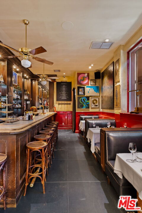 3924 Sunset Boulevard Los Angeles, CA 90029 - Photo 50 of 70 a kitchen with stainless steel appliances kitchen island granite countertop a sink and cabinets