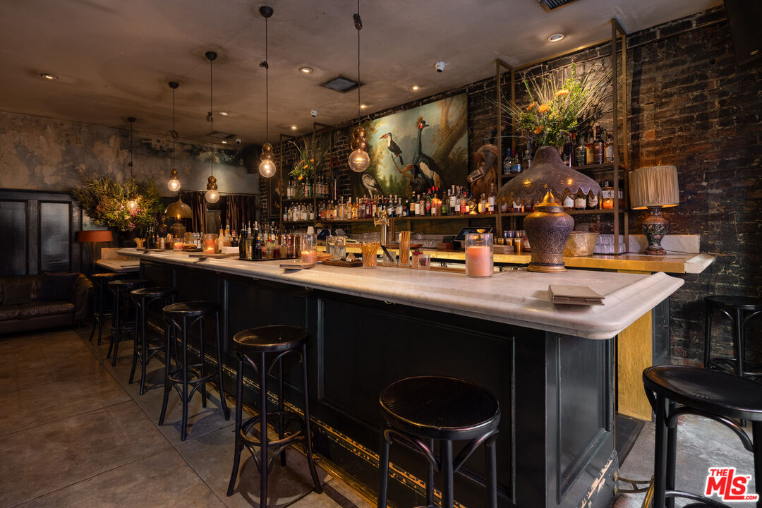 3924 Sunset Boulevard Los Angeles, CA 90029 - Photo 6 of 70 a kitchen with a table and chairs in it