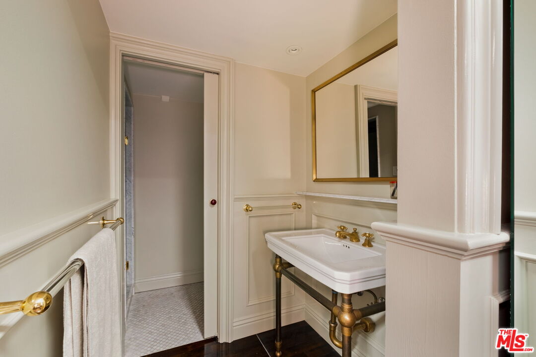 3924 Sunset Boulevard Los Angeles, CA 90029 - Photo 62 of 70 a bathroom with a sink vanity and a mirror