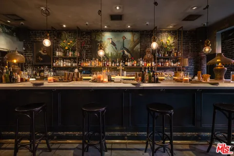 a kitchen with a table and chairs in it