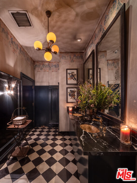 3924 Sunset Boulevard Los Angeles, CA 90029 - Photo 8 of 70 a bathroom with a sink and a mirror