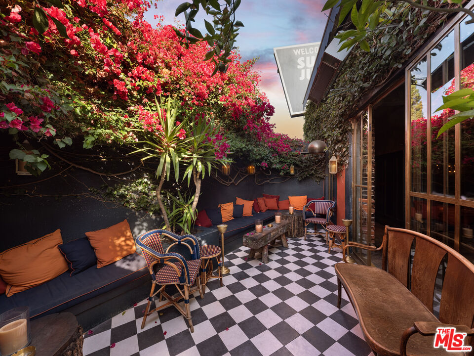 3924 Sunset Boulevard Los Angeles, CA 90029 - Photo 9 of 70 a backyard of a house with table and chairs