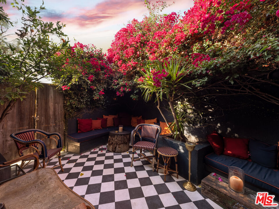 3924 Sunset Boulevard Los Angeles, CA 90029 - Photo 10 of 70 a backyard of a house with table and chairs