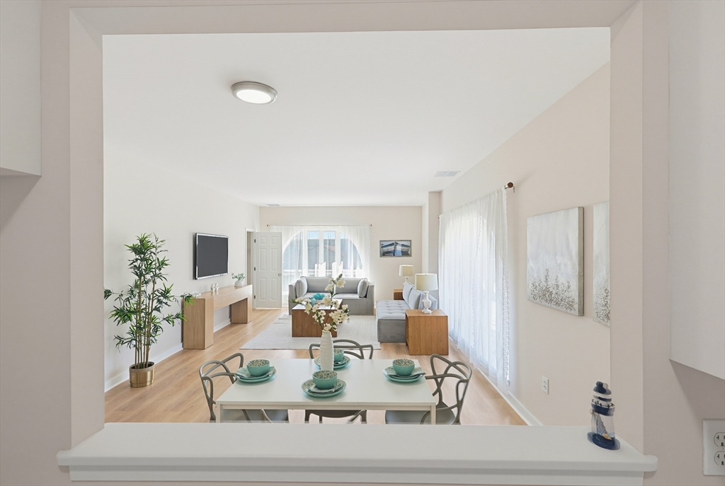 45 Main Street, Unit 35 Wareham, MA 02571 - Photo 8 of 34 a view of a dining room with furniture and wooden floor
