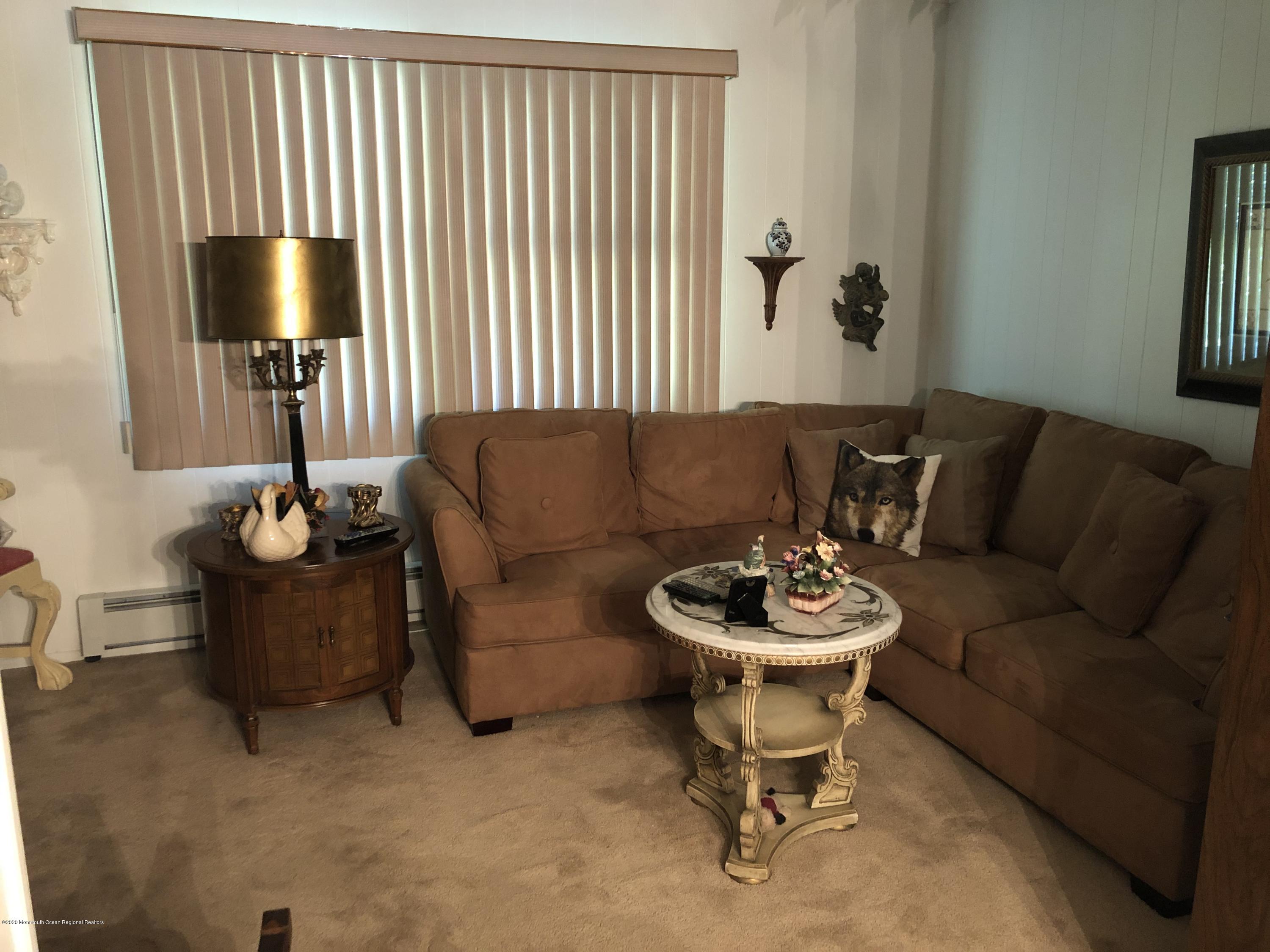 132 Georgetown Road Toms River, NJ 08757 - Photo 14 of 18 a living room with furniture and a flat screen tv