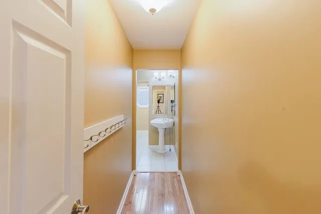 a living room with furniture and a pool table