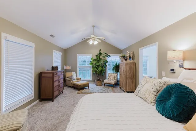 a white toilet sitting next to a shower curtain