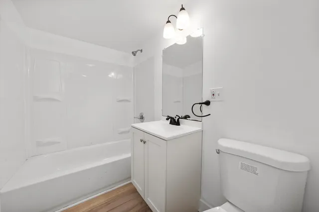 a bathroom with a sink a toilet and bathtub