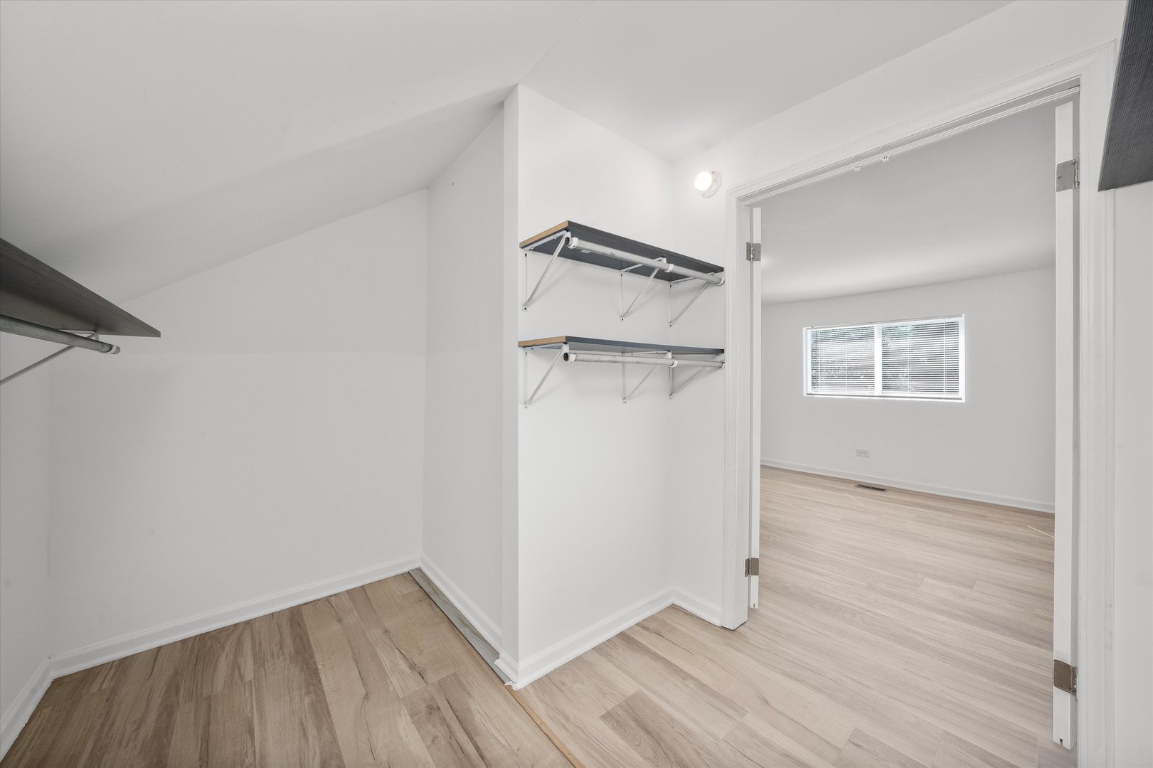 14732 Turner Avenue, Unit D Midlothian, IL 60445 - Photo 21 of 28 a view of a room with wooden floor and a ceiling fan
