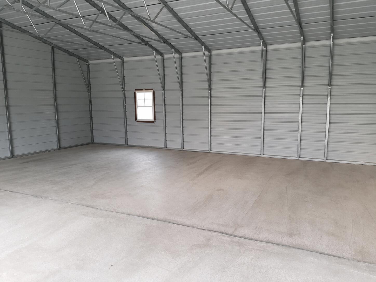 1701 Martin Nethery Road Waddy, KY 40076 - Photo 30 of 30 This is an AI photo to show the interior of the garage empty.