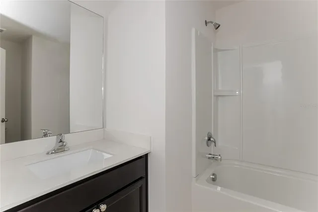 a bathroom with a sink and a bathtub