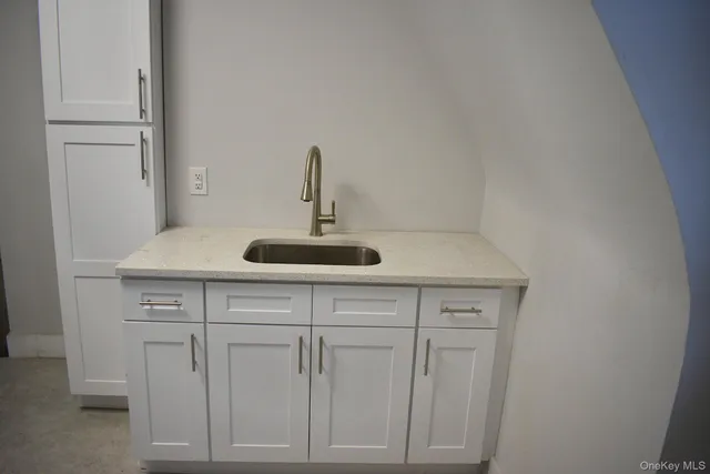 a close view of shoes stand and cabinets