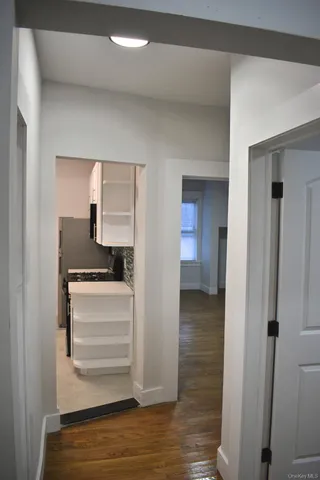 a view of storage and utility room in wooden floor