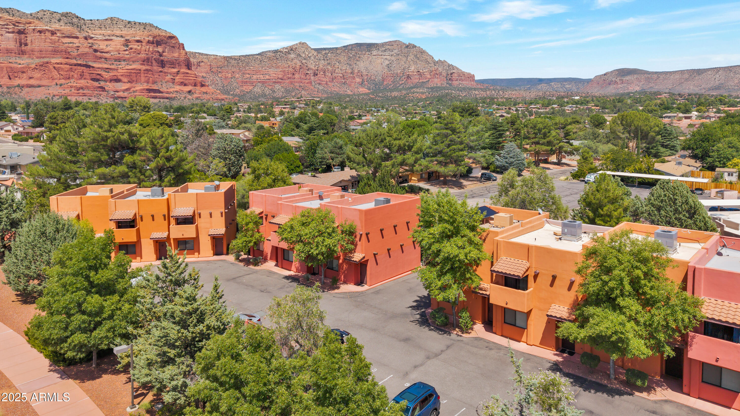 an aerial view of a city with lots of residential buildings