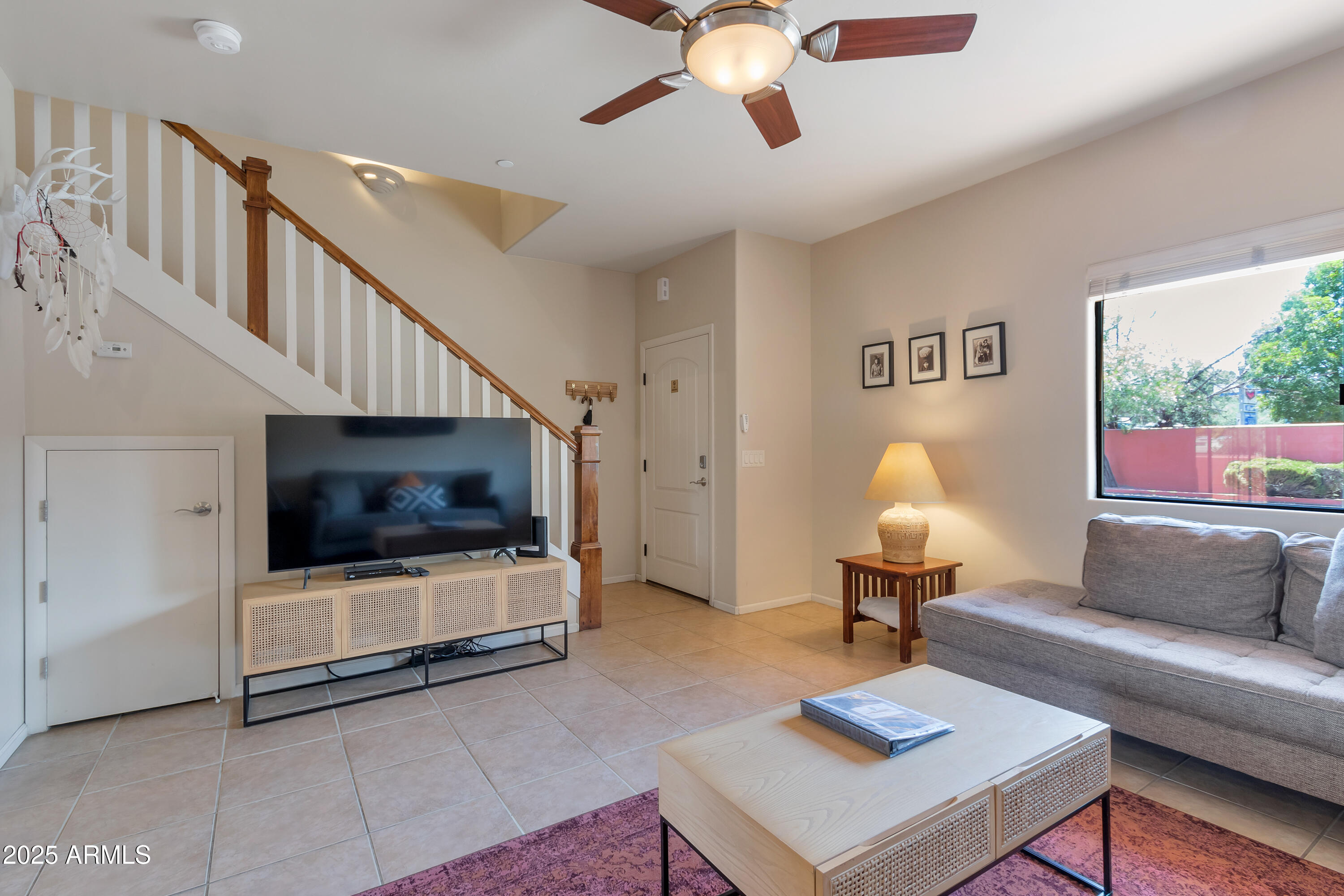 45 Canyon Diablo Road, Unit 5 Sedona, AZ 86351 - Photo 11 of 25 a living room with furniture and a flat screen tv