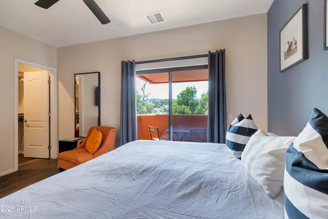 a bedroom view with a large bed and a flat screen tv