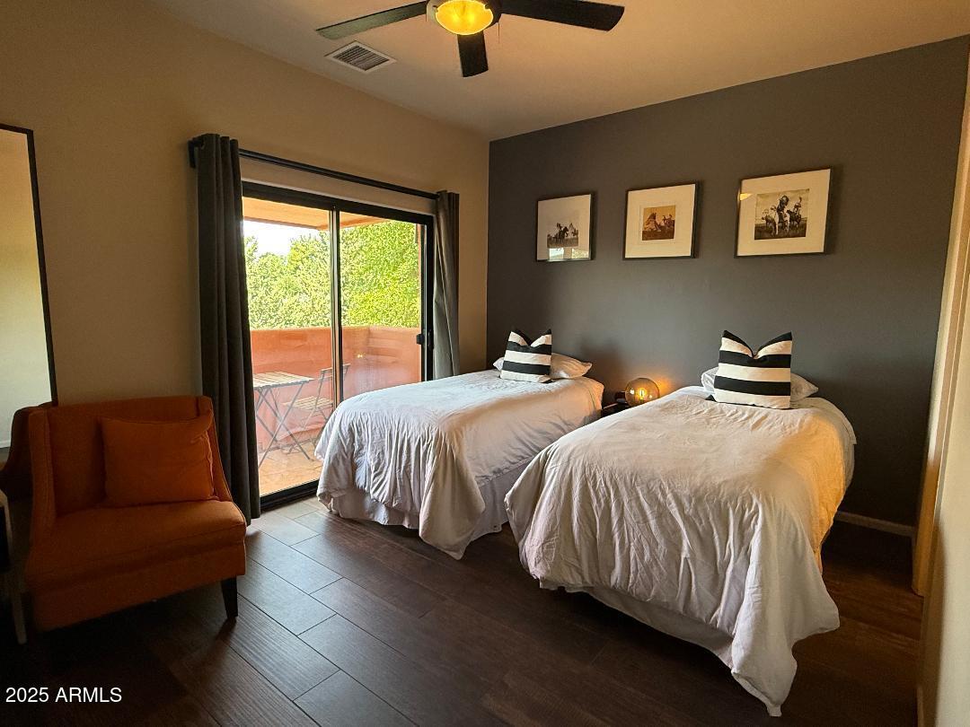 45 Canyon Diablo Road, Unit 5 Sedona, AZ 86351 - Photo 18 of 25 a spacious bedroom with two beds and a couch