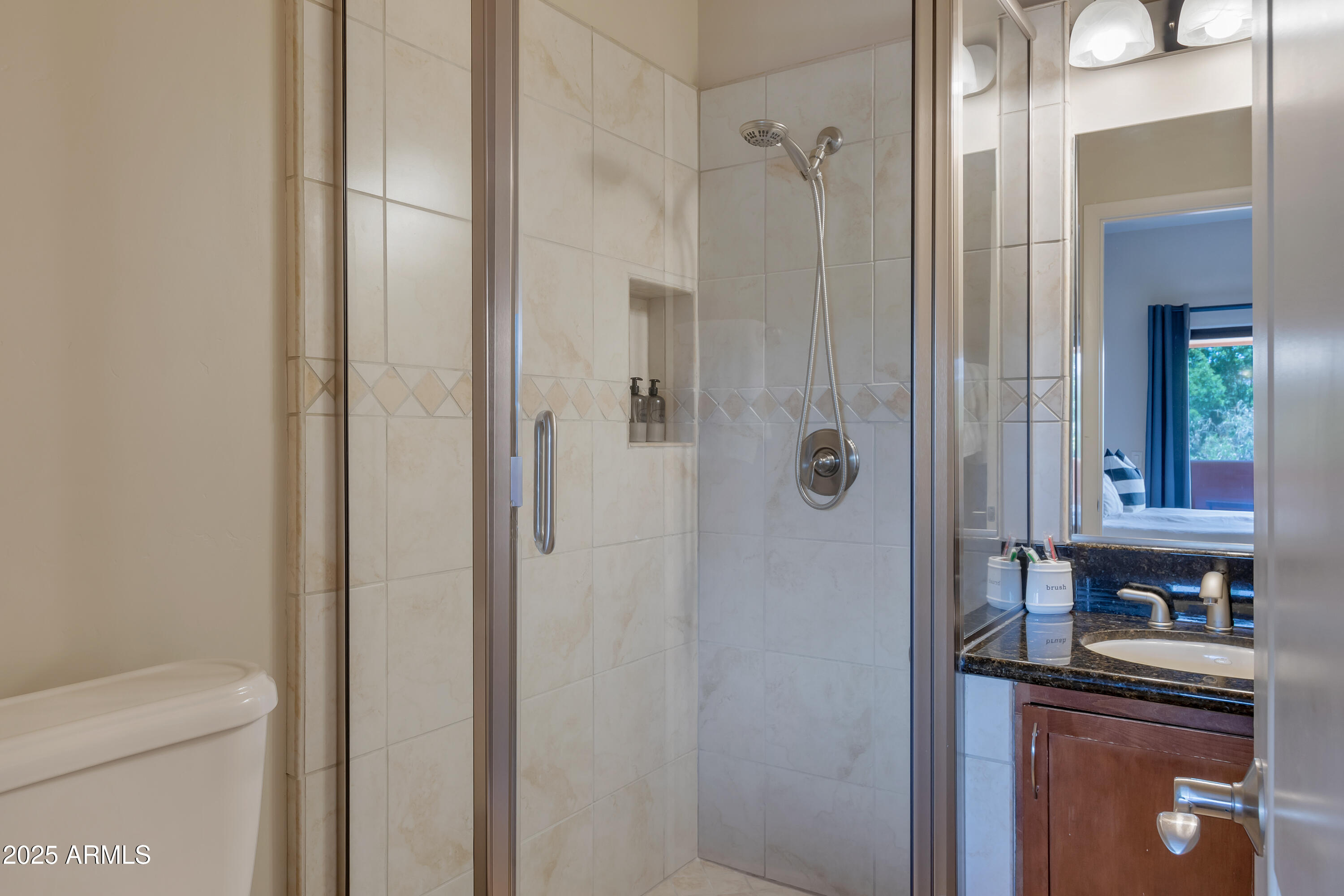 45 Canyon Diablo Road, Unit 5 Sedona, AZ 86351 - Photo 20 of 25 a bathroom with a granite countertop sink a toilet and shower