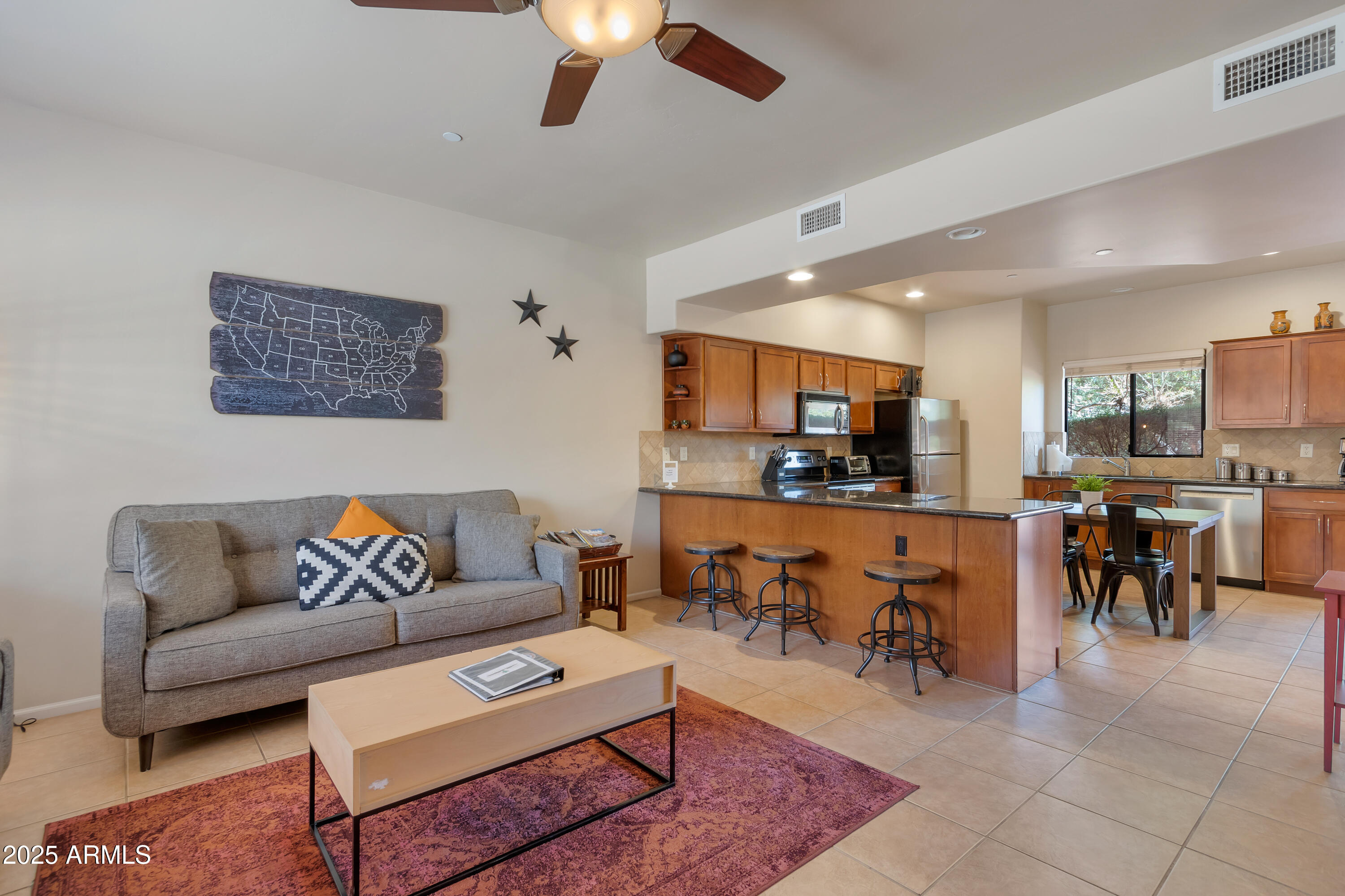 45 Canyon Diablo Road, Unit 5 Sedona, AZ 86351 - Photo 4 of 25 a living room with furniture kitchen view and a table