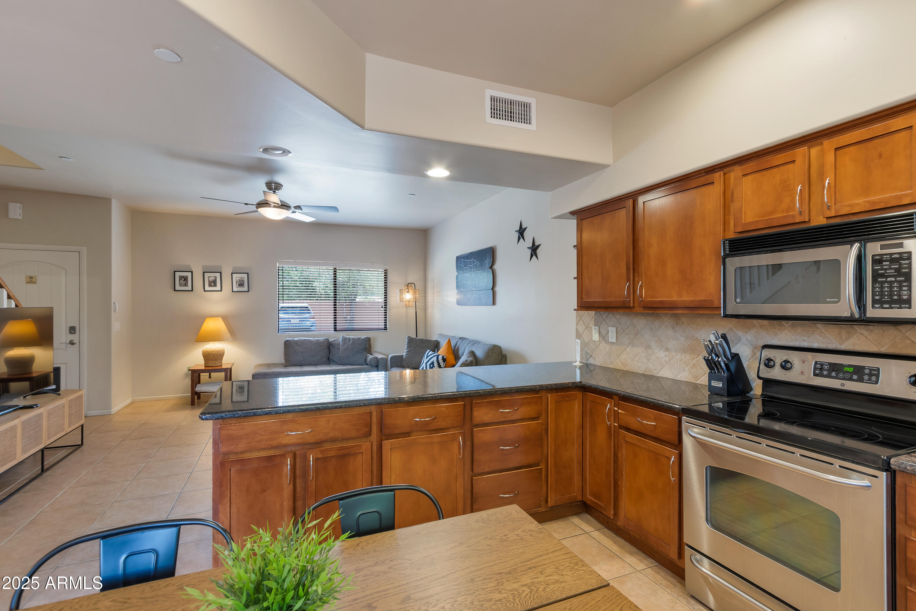 45 Canyon Diablo Road, Unit 5 Sedona, AZ 86351 - Photo 7 of 25 a kitchen with stainless steel appliances a sink stove and cabinets