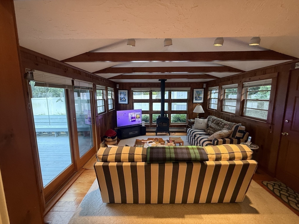 40 Studley Road, Unit 1 Barnstable, MA 02601 - Photo 11 of 24 a view of living room with furniture and a floor to ceiling window