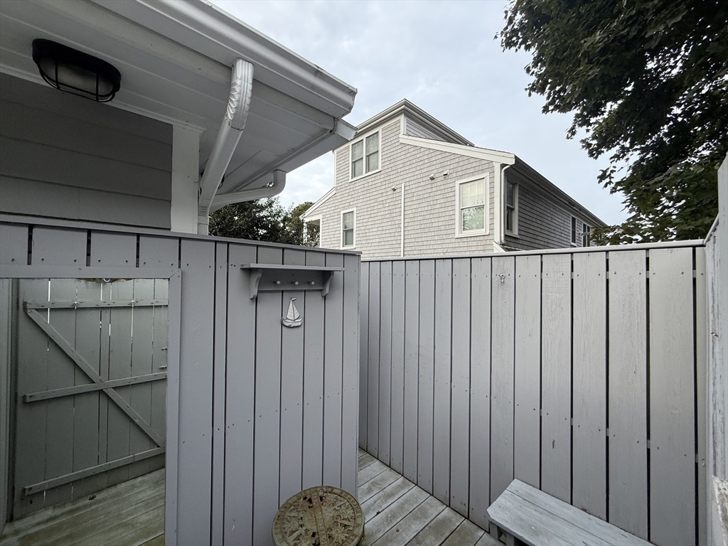 40 Studley Road, Unit 1 Barnstable, MA 02601 - Photo 21 of 24 a view of a wooden fence