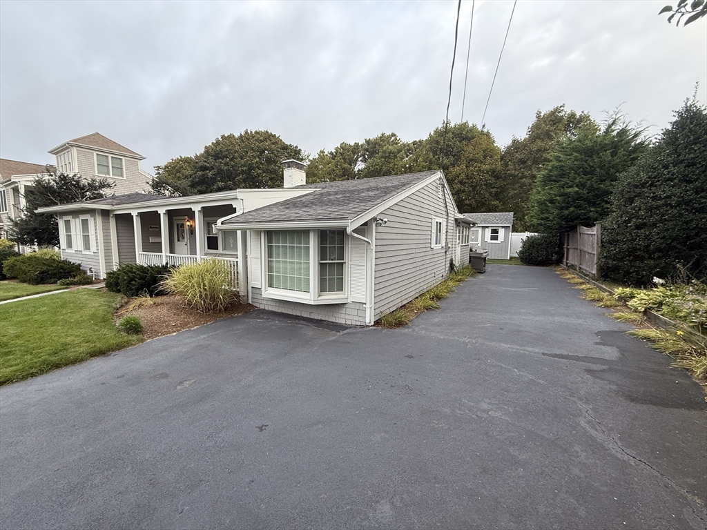 40 Studley Road, Unit 1 Barnstable, MA 02601 - Photo 24 of 24 a view of a house with a yard and potted plants