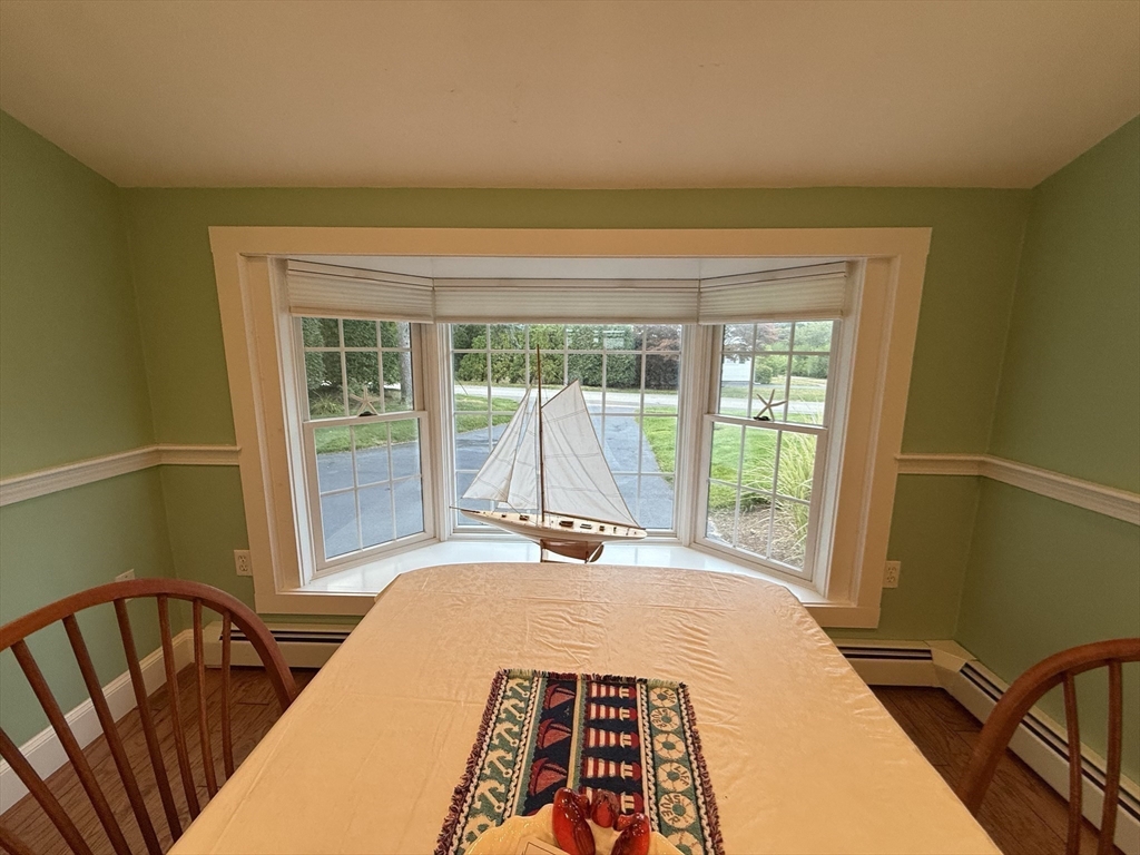 40 Studley Road, Unit 1 Barnstable, MA 02601 - Photo 9 of 24 a bedroom with a bed and wooden floor