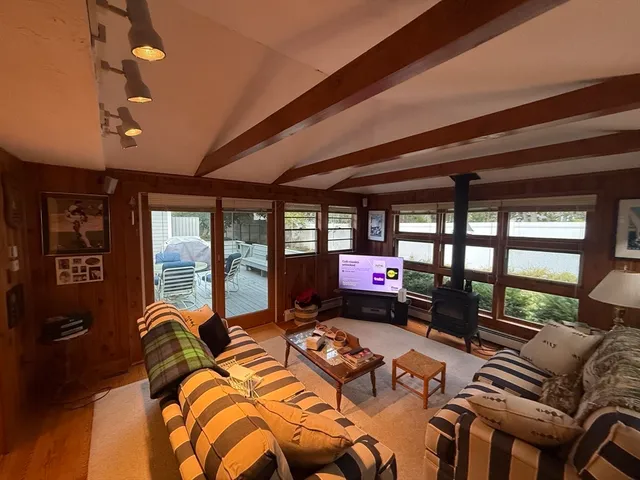 a bed room with furniture and a floor to ceiling window