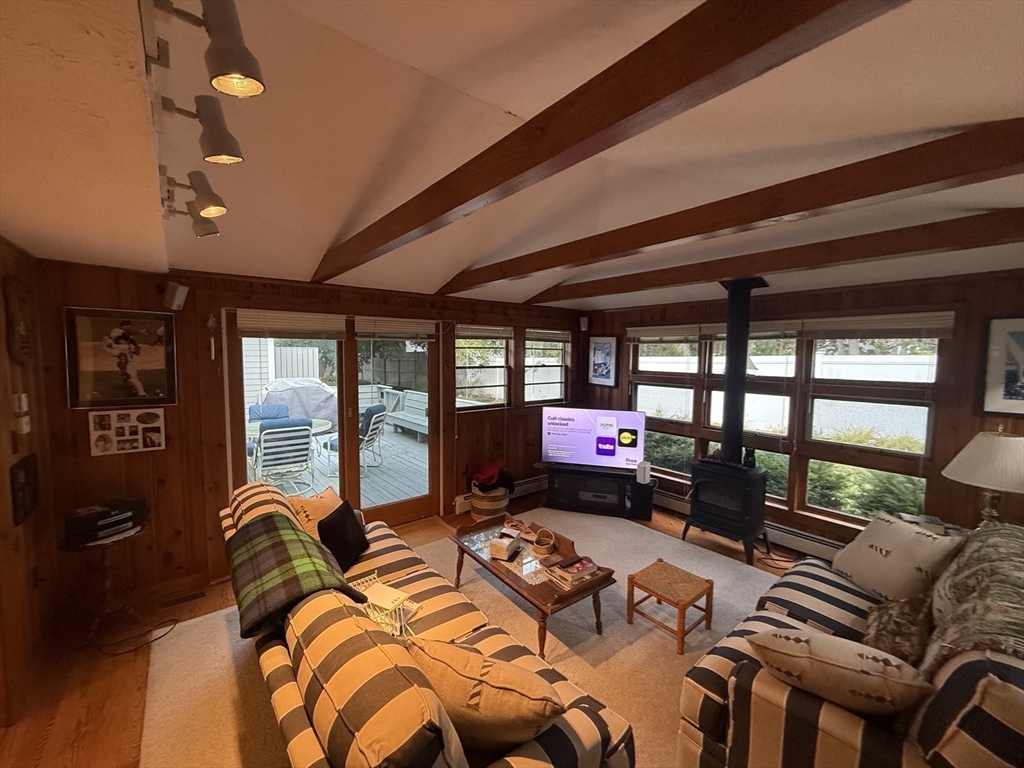 40 Studley Road, Unit 1 Barnstable, MA 02601 - Photo 10 of 24 a bed room with furniture and a floor to ceiling window