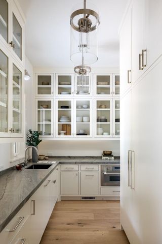 a kitchen with stainless steel appliances granite countertop a stove and a sink