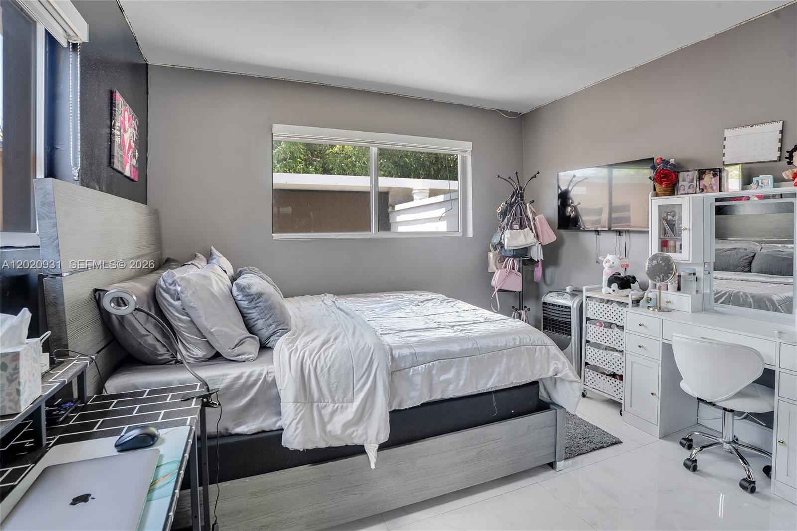 1360 Northwest 77th Street Miami, FL 33147 - Photo 16 of 41 a bedroom with a bed and a desk
