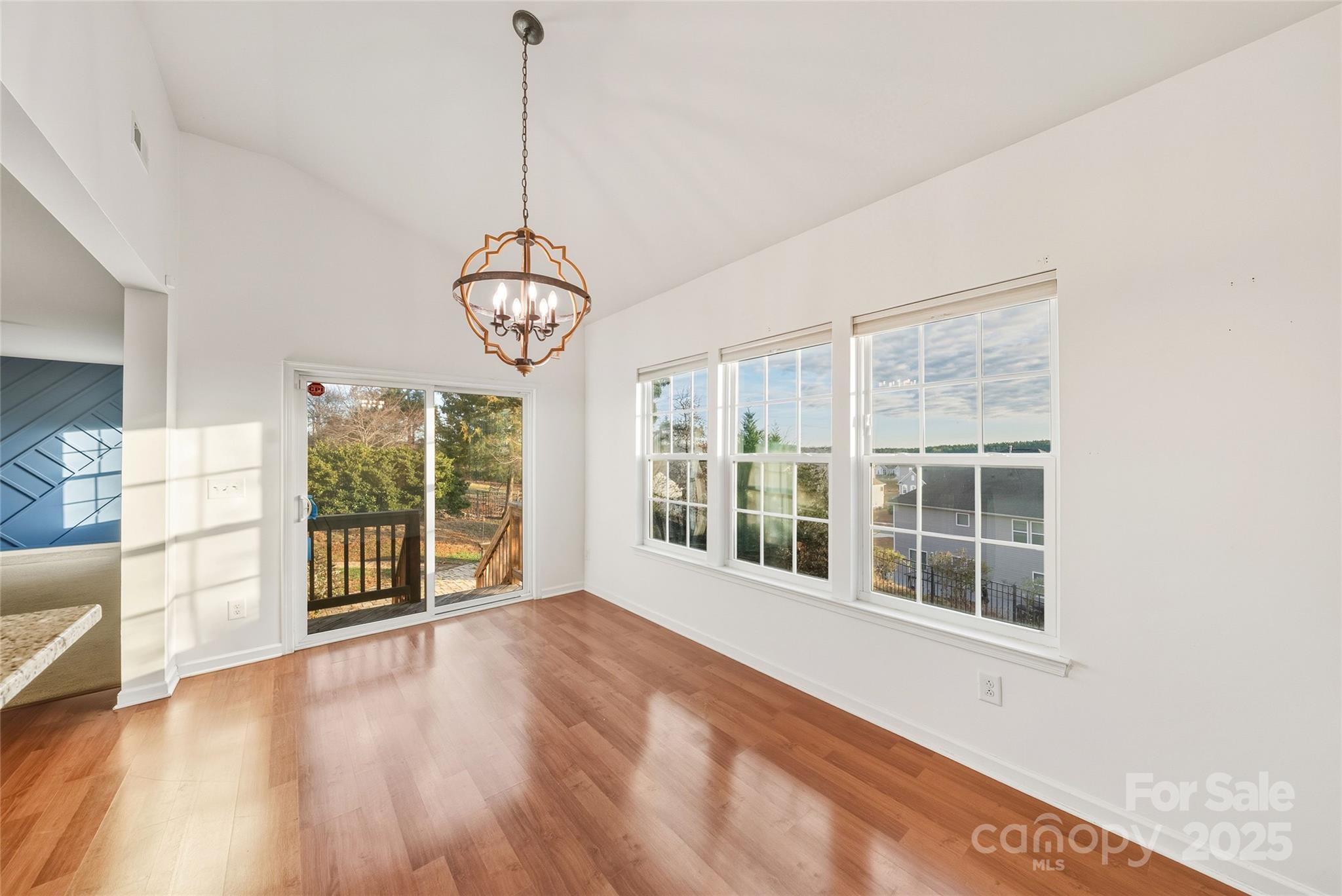 2155 Galloway Lane Southwest Concord, NC 28025 - Photo 14 of 40 a view of an empty room with a window and wooden floor