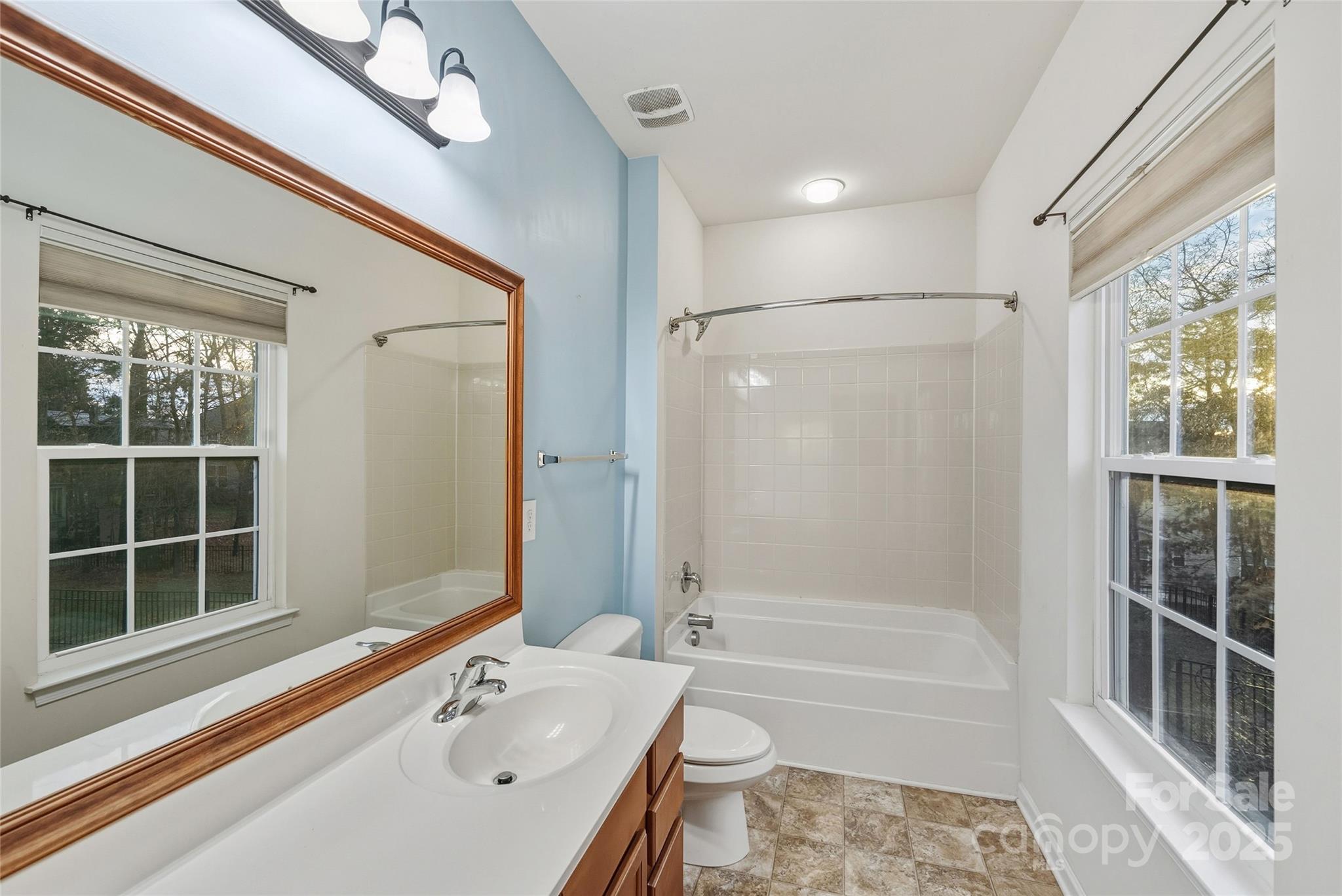 2155 Galloway Lane Southwest Concord, NC 28025 - Photo 15 of 40 a bathroom with a bathtub shower and a sink
