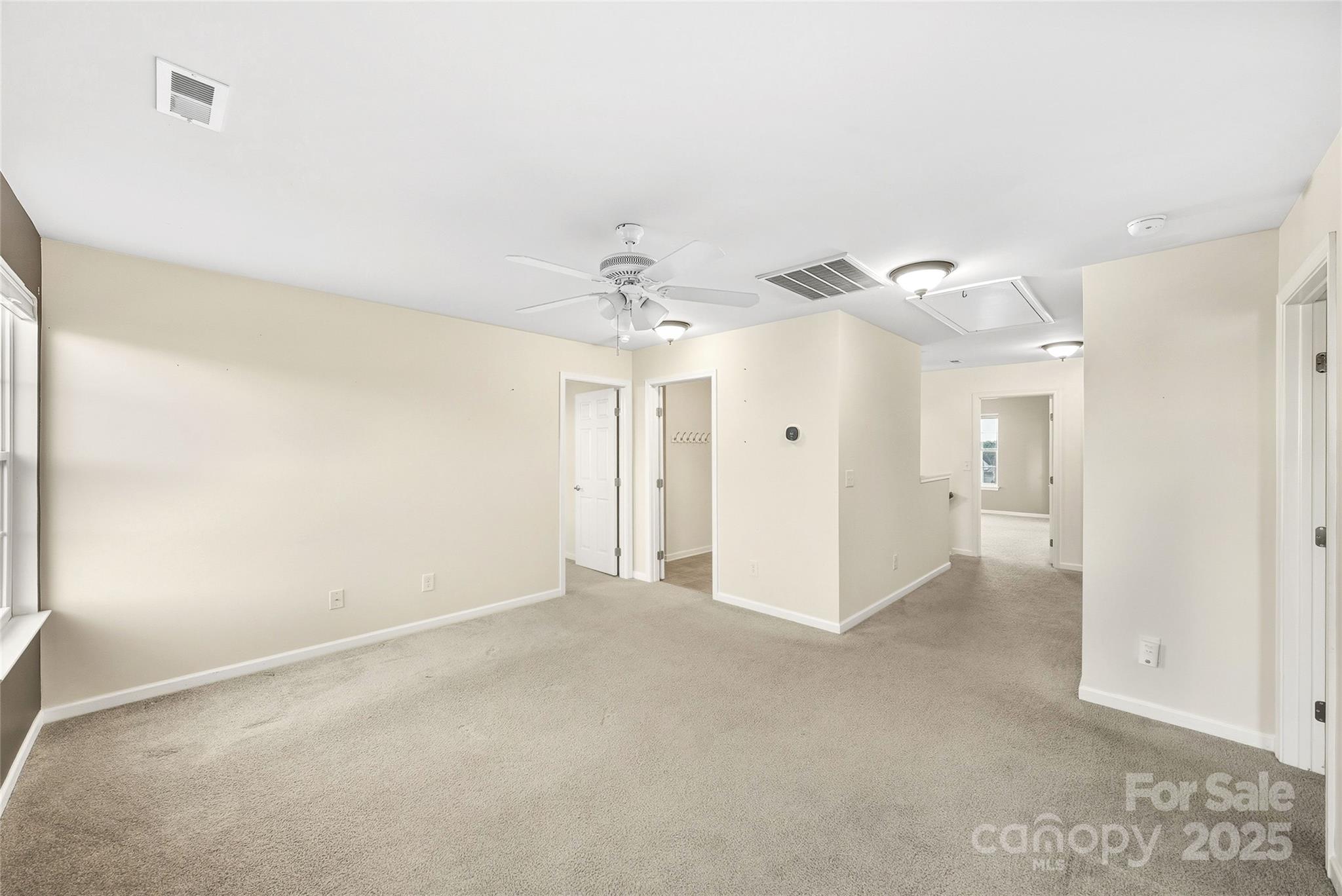 2155 Galloway Lane Southwest Concord, NC 28025 - Photo 31 of 40 a view of a big room with a chandelier fan and refrigerator