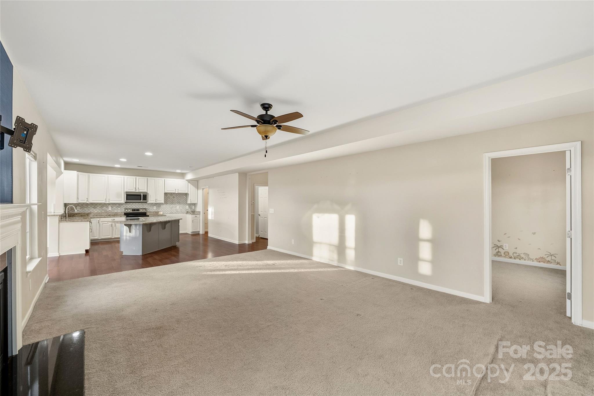2155 Galloway Lane Southwest Concord, NC 28025 - Photo 4 of 40 a view of a kitchen with a sink and a refrigerator