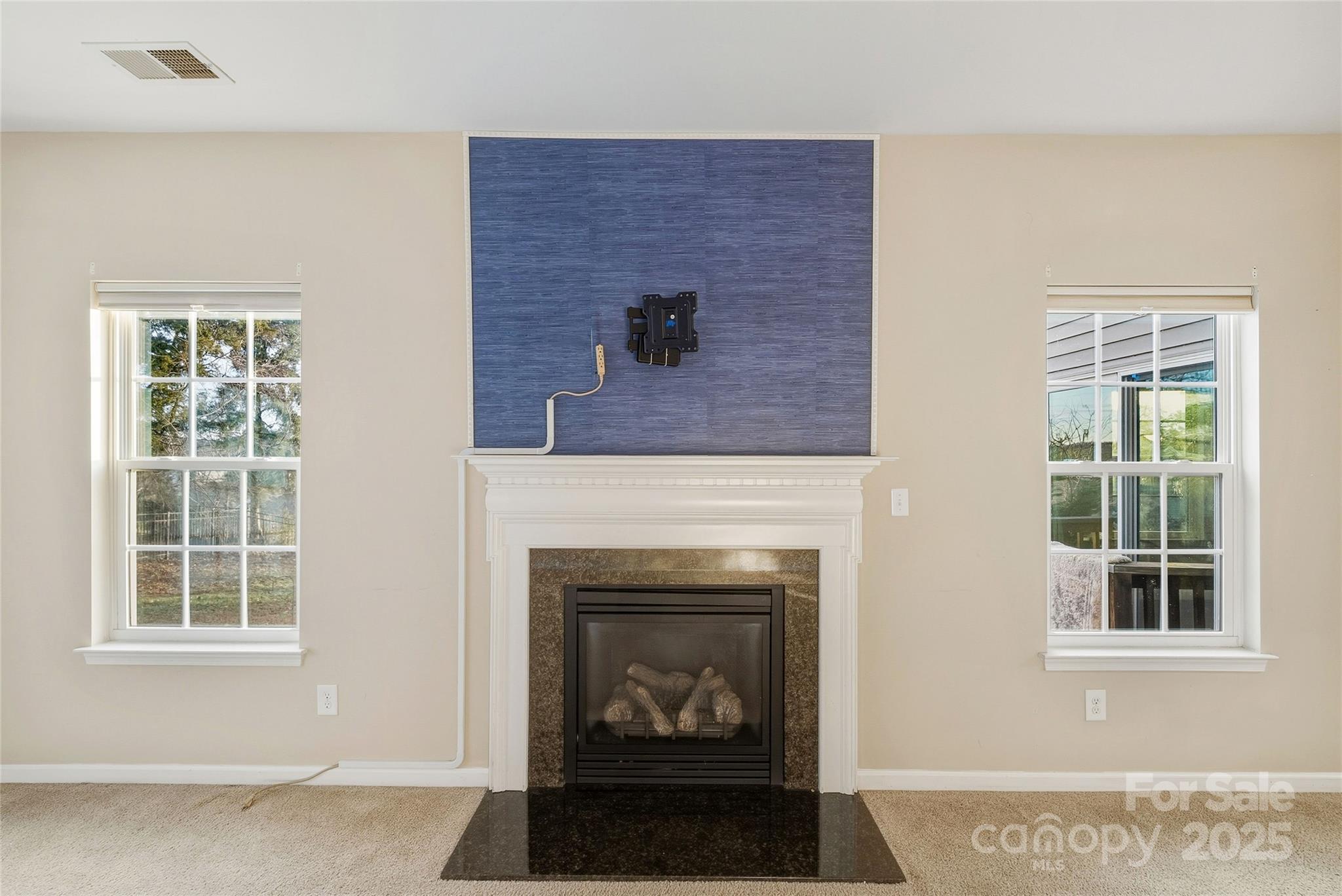 2155 Galloway Lane Southwest Concord, NC 28025 - Photo 6 of 40 a living room with a fireplace and a window