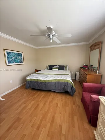 a bedroom with bed and window