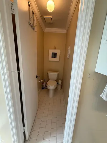 a bedroom with a bed and a ceiling fan